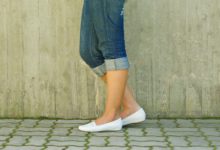 woman wearing flat shoes 7 ways to get rid of back pain by healthista
